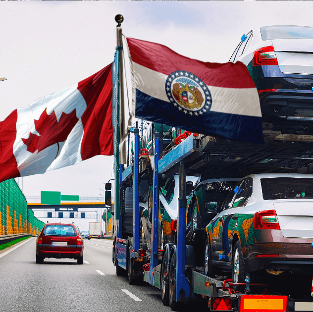 Open transport truck with Canadian flag and Missouri state flag.